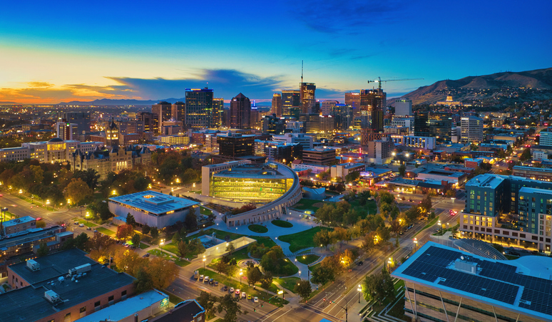 An aerial view of Salt Lake City lit up at sundown