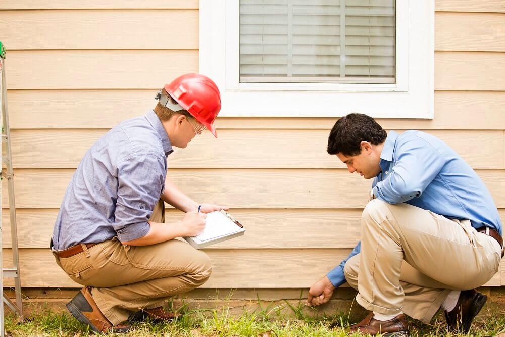 Inspectors check a homes foundation.