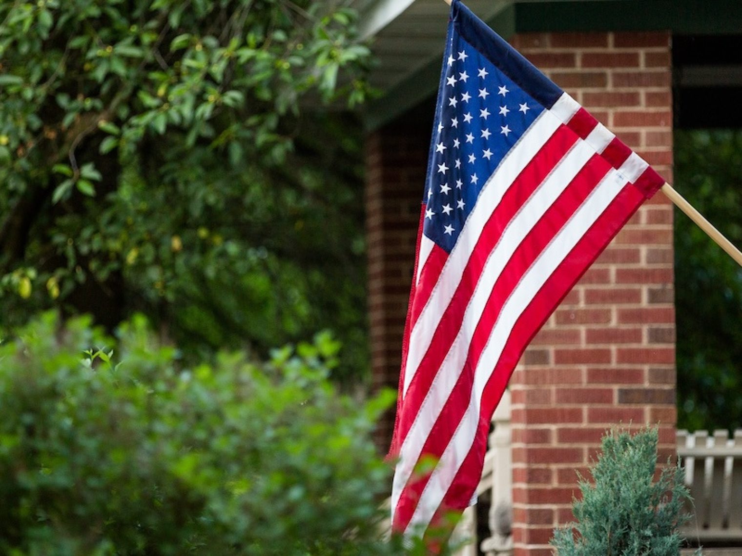 American flag displayed on the front of house.