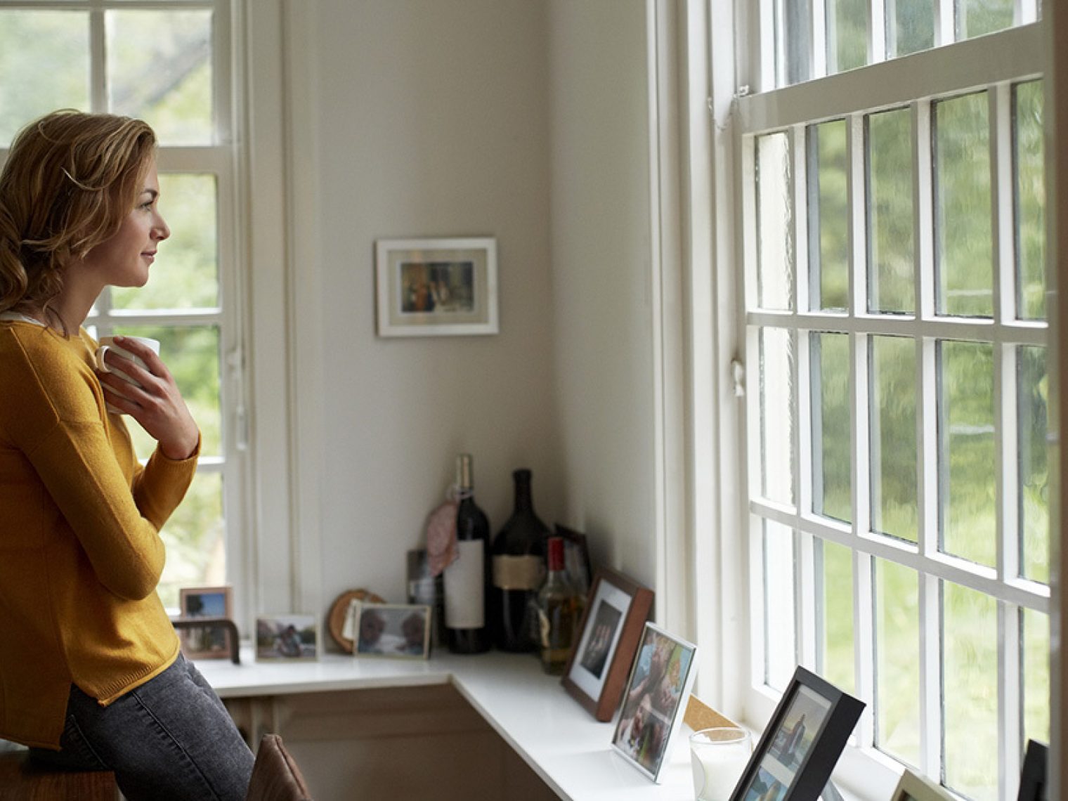 Surviving spouse looking out the window.