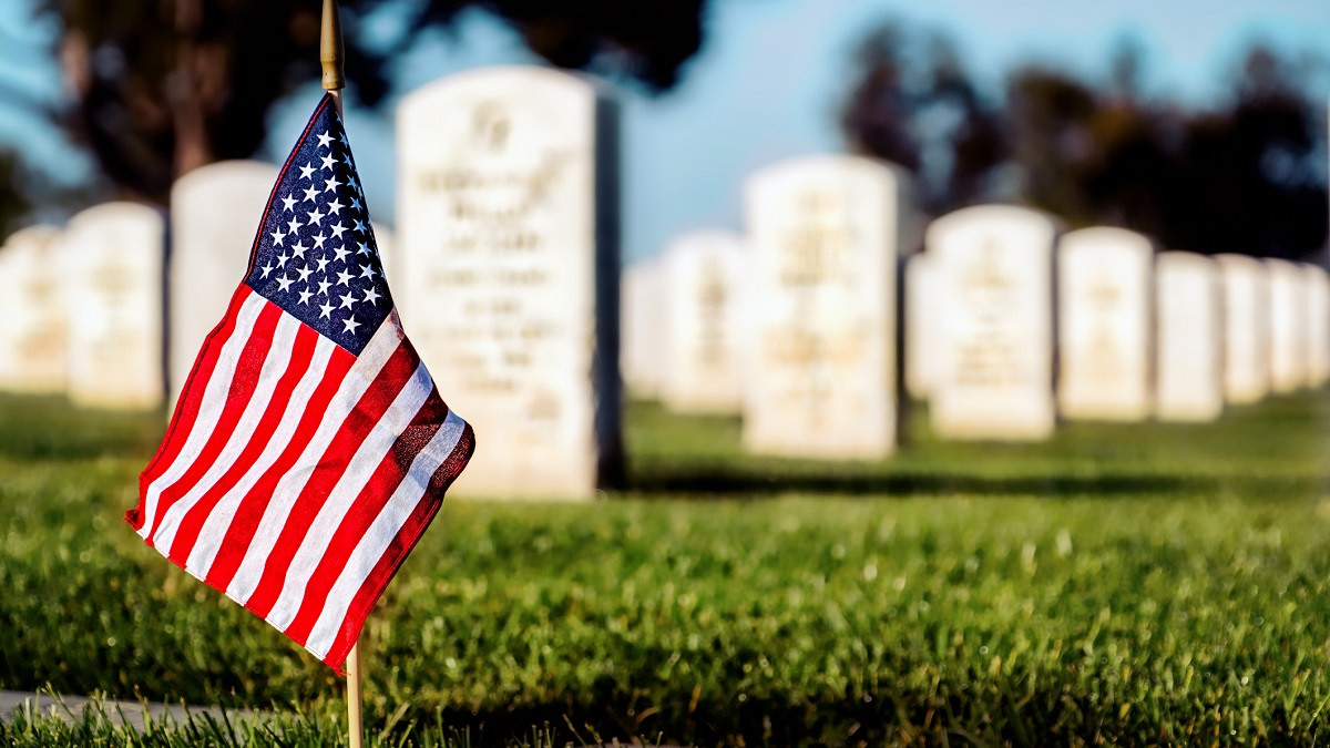 Flag planted in military cemetery.